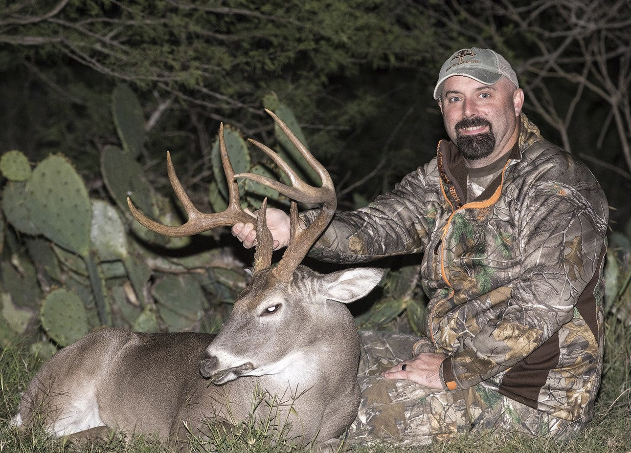 food plot seed biologist Mark Newell with deer